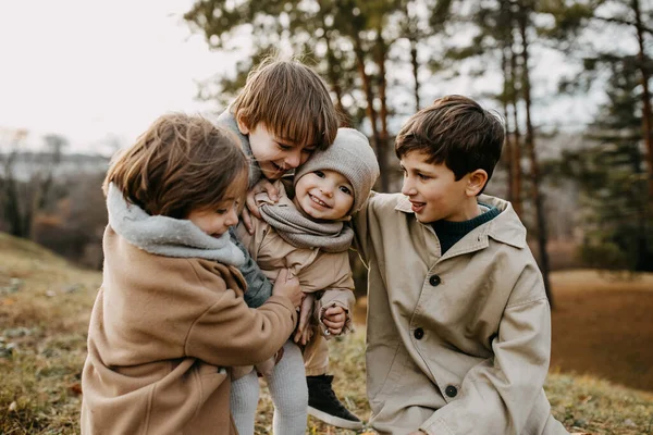 Brothers Hugging Little Sister Smiling Spending Time Outdoors Park Autumn — Stockfoto