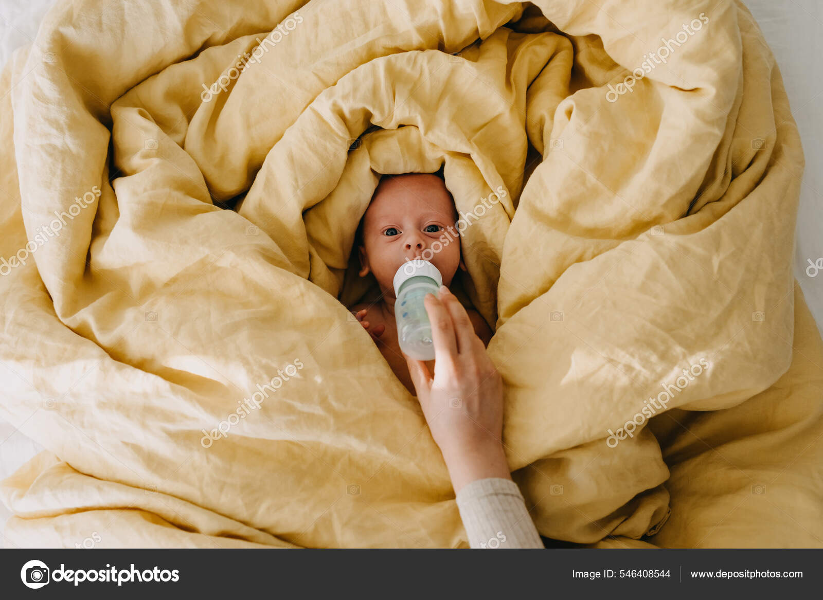 Mother Bottle Feeding Baby Lying Bed Covered Big Yellow Blanket
