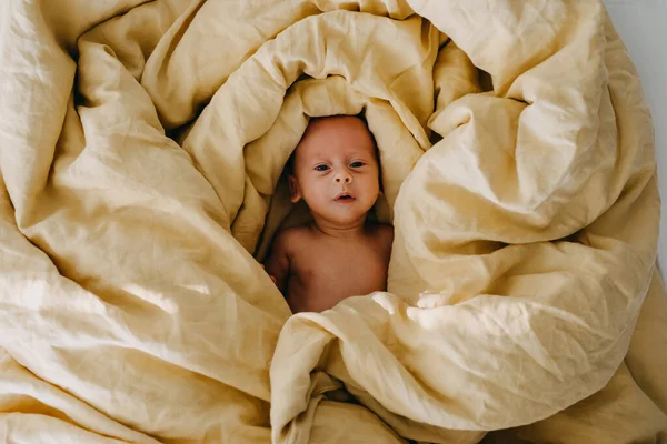 Newborn Baby Lying Bed Covered Big Yellow Blanket Top View — Stock Photo, Image