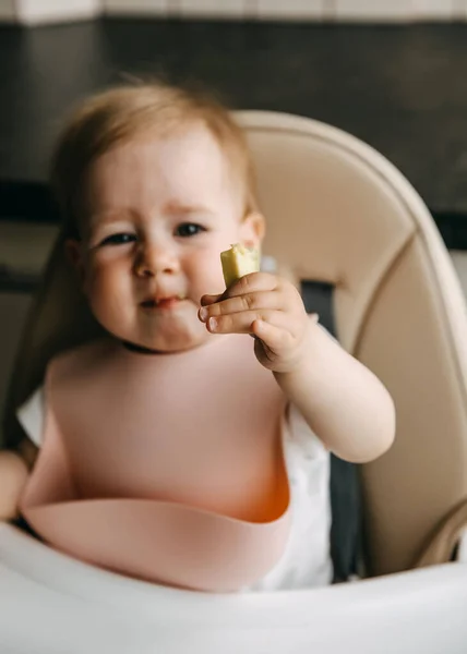 Months Old Baby Sitting High Chair Silicone Bib Eating Avocado — стоковое фото