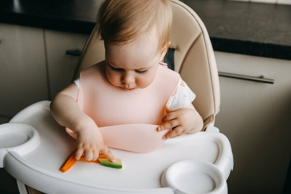 Months Old Baby Sitting High Chair Silicone Bib Taking Vegetables Royalty Free Stock Images