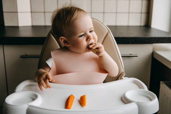 Months Old Baby Sitting High Chair Silicone Bib Eating Avocado Stock Picture