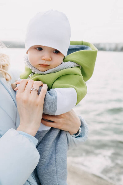 Mother Holding Baby Her Arms Lake Cold Spring Day Royalty Free Stock Photos