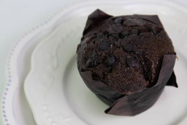 Chocolate Muffin Topped Chocolate Chips White Ceramic Plate Tasty Dessert — Foto de Stock