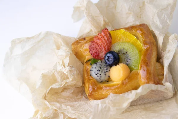 Mixed Fruit Danish Wrapped Brown Paper White Background — Stockfoto