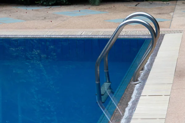 a peaceful swimming pool in the green garden