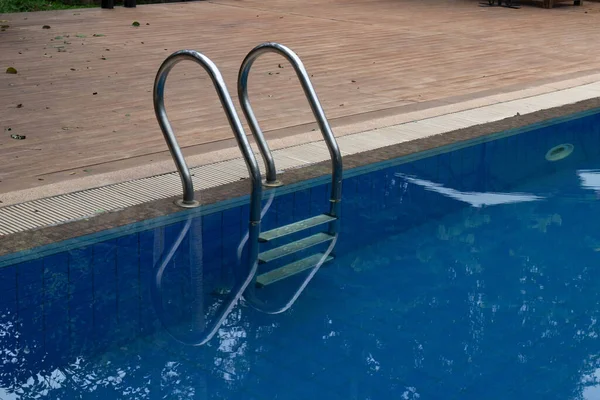 a peaceful swimming pool in the green garden