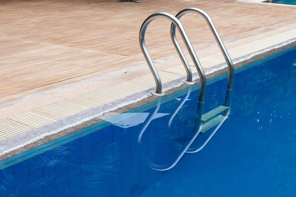 a peaceful swimming pool in the green garden