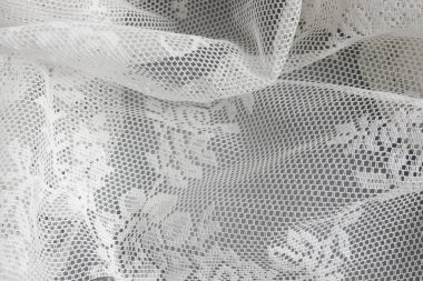 Elegant white lace placed on Grey Background