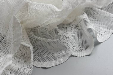 Elegant white lace placed on Grey Background