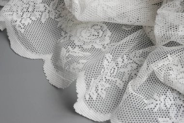 Elegant white lace placed on Grey Background