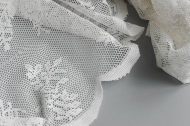 Elegant white lace placed on Grey Background