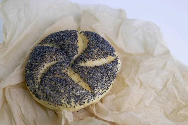 Poppy Seeds Kaiser Roll Wrapped Brown Paper White Background — 图库照片
