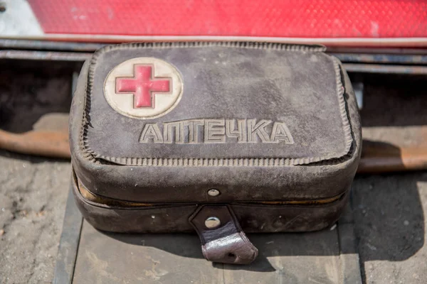 Vintage car first aid kit isolated outside background.