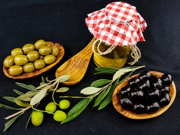 cold pressed olive oil with branch and fruits