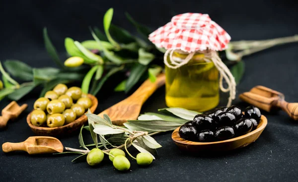 cold pressed olive oil with branch and fruits