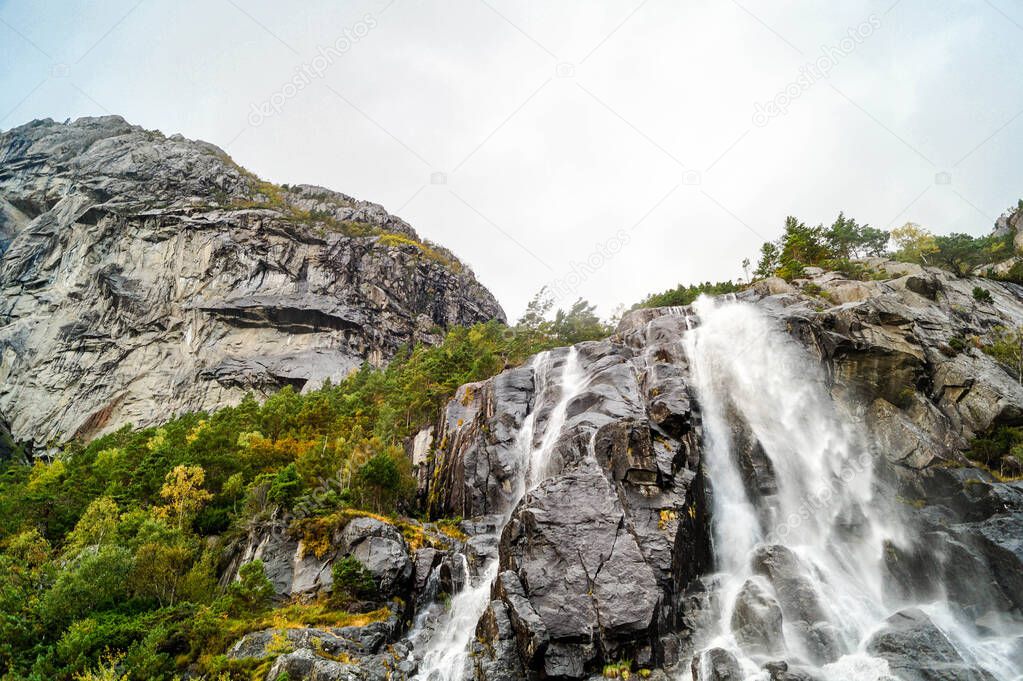 Rock formation in the Lysefjord with the famous Hengjanefossen waterfall