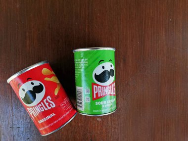 Bali,Indonesia - April 15 2022 : Empty potato chips box, placed on brown wooden background