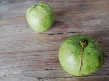 Guavas fruit, in Indonesian language names (Jambu Kristal ),placed on wooden background