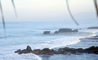 Seascapes at south cost in Bali island of Indonesia,with rock formation and big wave