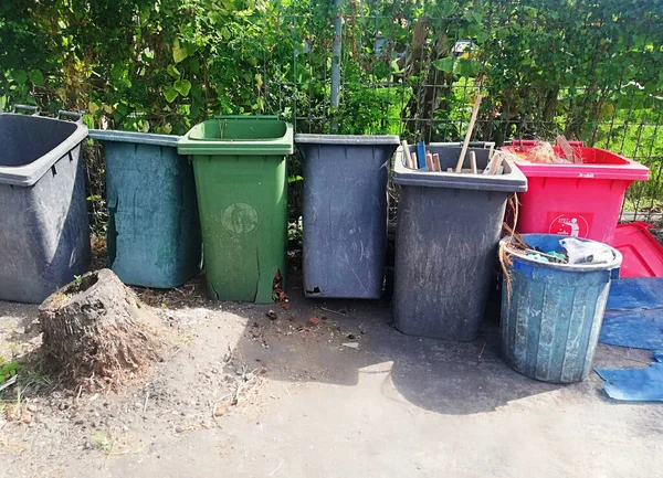 Groups of big garbage bins,placed on the floor