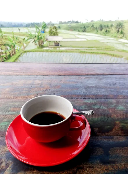 Black Coffee Red Color Cup Placed Wooden Table Rice Field — Stock Photo, Image
