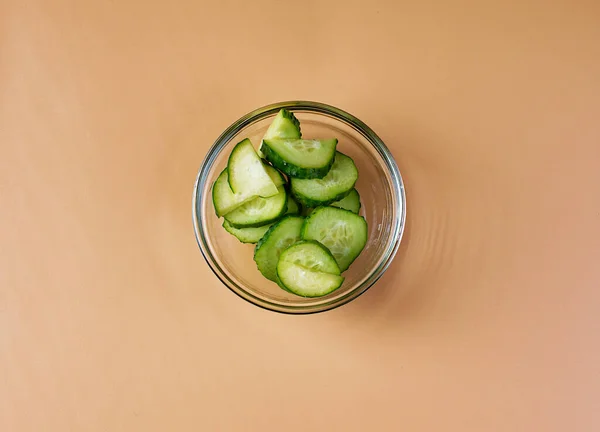 Bowl Fresh Cut Cucumbers Orange Background Salad Ingredients — Stockfoto