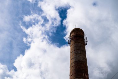 The top of an old water tower against a sky with clouds in Sloka, Jurmala, Latvia.