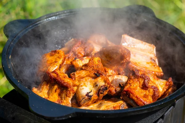 Close Fried Pieces Pork Ribs Black Cast Iron Cauldron Food — 스톡 사진