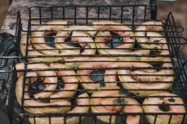 Close-up of pickled green zucchini grilled. Picnic, cooking in nature. Grilling vegetables, healthy food.