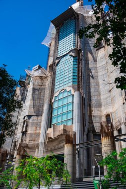 Barcelona, Spain - May 28 2022: In the frame is the famous Sagrada Familia basilica during construction. Close-up of the details of the architecture of the cathedral.
