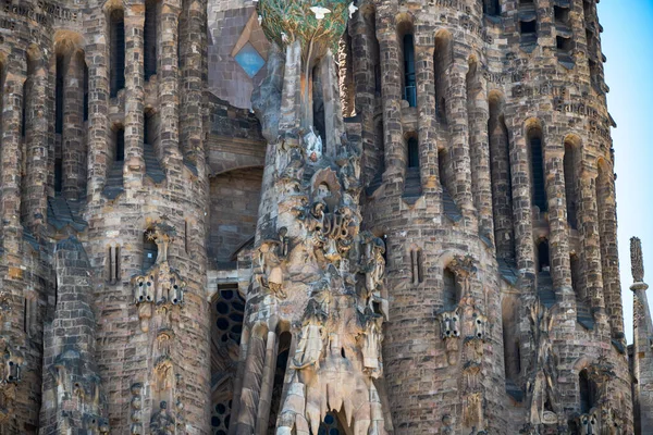 Barcelona, Spain - May 28 2022: In the frame is the famous Sagrada Familia basilica during construction. Close-up of the details of the architecture of the cathedral.