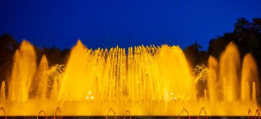 Night Photograph Of The Performance Of The Singing Magic Fountain Of Montjuic In Barcelona, Catalonia, Spain.