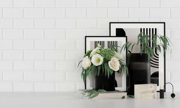 Interior Decor. Bouquet of flowers in a vase, books, candlestick, paintings. On the background of white tiles.