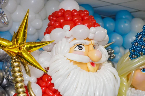 New Years figures of Santa Claus and Snow Maiden from balloons. Celebrating new year, christmas