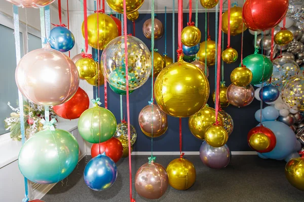 Christmas balls are hung on ribbons. Celebrating new year, christmas.