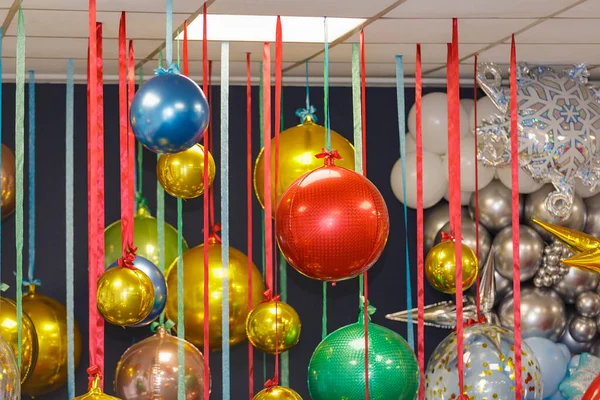 Christmas balls are hung on ribbons. Celebrating new year, christmas — Stockfoto