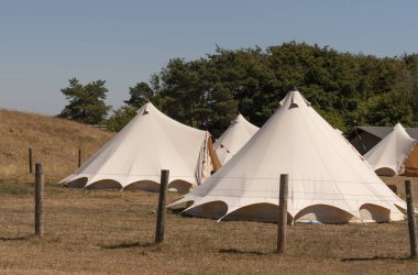 The Cotswolds, Gloucestershire, England, UK. 2022. Bell tents for a glamping holiday rental in the Cotswolds region of Gloucestershire, England, UK.