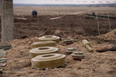 Demining by troops of the territory. Many mines, shells, artillery, grenades, fragmentation grenades