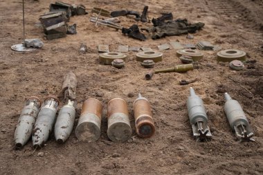 Demining by troops of the territory. Many mines, shells, artillery, grenades, fragmentation grenades