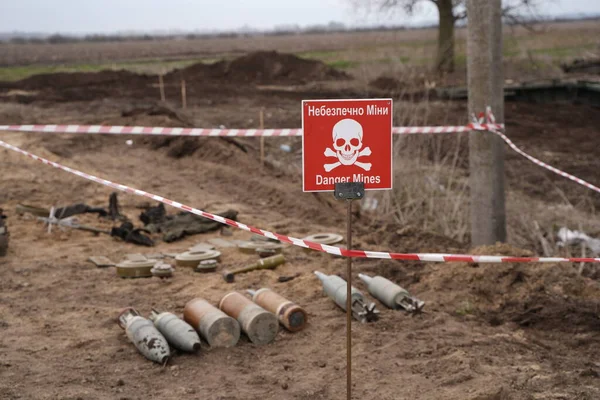 Demining by troops of the territory. Many mines, shells, artillery, grenades, fragmentation grenades