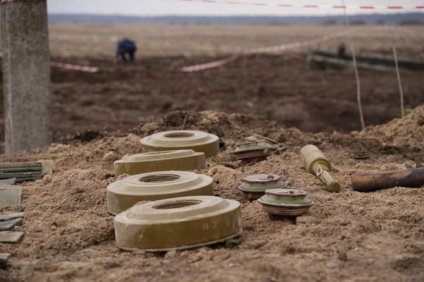 Demining by troops of the territory. Many mines, shells, artillery, grenades, fragmentation grenades