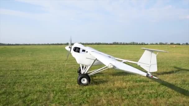 Unmanned aerial vehicle. UAV cargo delivery. The plane leaves the field for takeoff. The compact device on gasoline. — Wideo stockowe