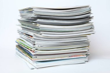 A large stack of printing magazines on a white background. Lots of different publications