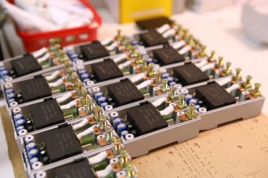 Assembly of electronic components for voltage relays. Manual assembly of electronic components for home electrical systems...
