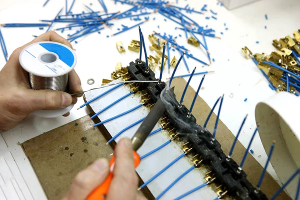 Man Collects Printed Circuit Board Worker Solders Radio Components Assembles —  Fotos de Stock