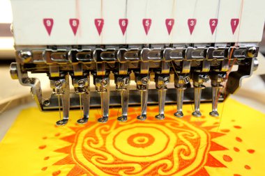 High technology automatic sewing machine control by computer programming. Sewing machine for mass production manufacturing industrial factory.
