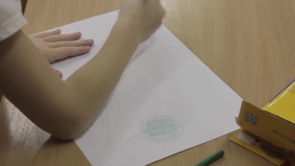 Little Boy Draws Landscape Paper Sheet Blue Pencil Wooden Table — Stock Video