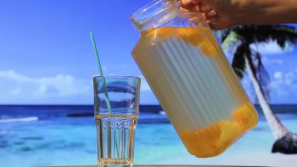 Woman Ocean Beach Pours Cocktail Glass Cold Lemonade Island Palm — Vídeo de stock