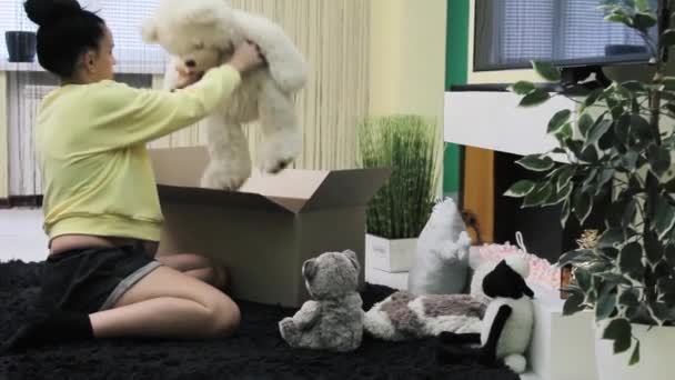 Young Pregnant Girl Puts Baby Toys Box Shipping — Stockvideo